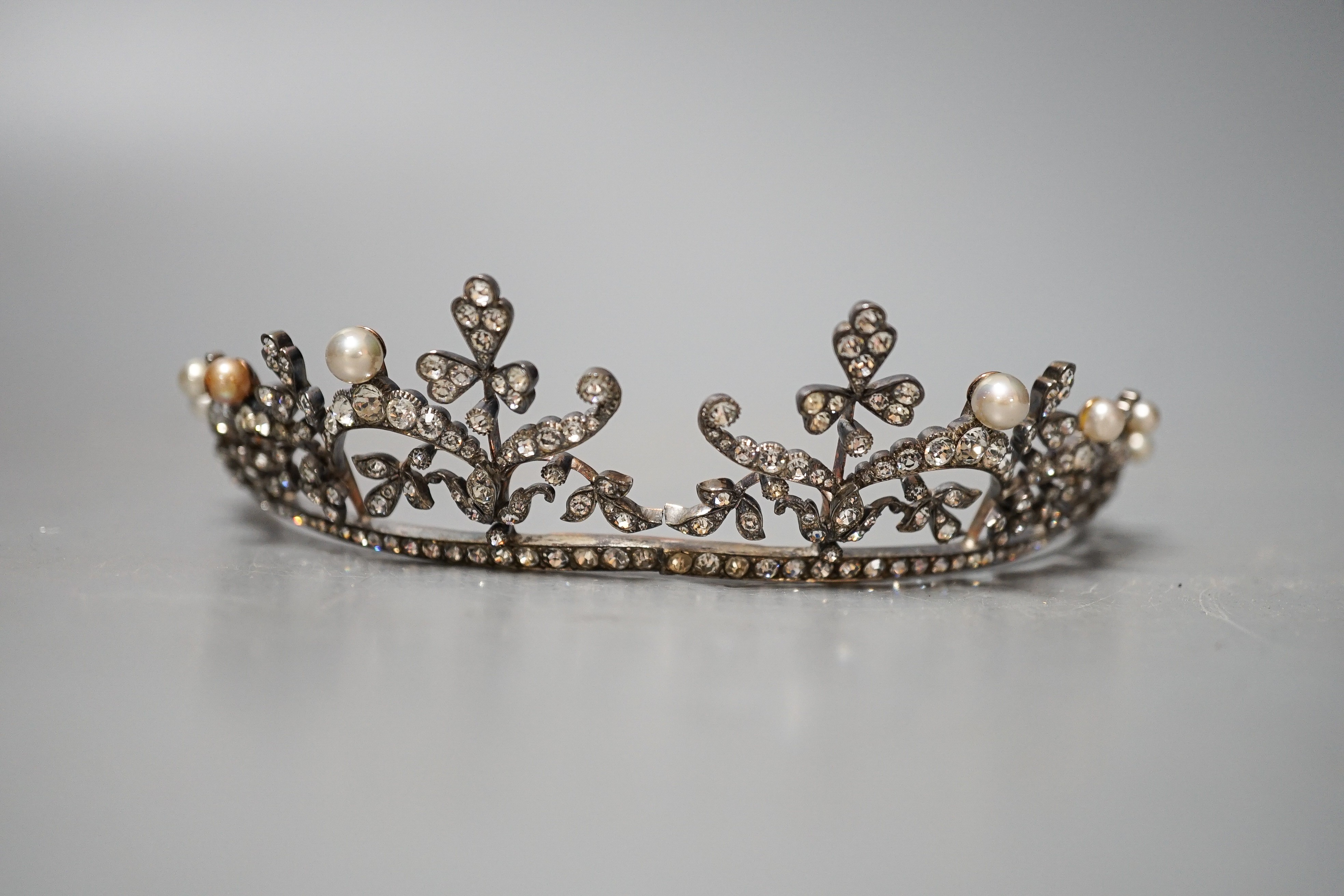 An Edwardian white metal and paste set tiara, 13cm.
